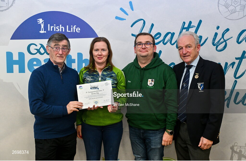 14 December 2023; The Nealle, Mayo, representatives Ita Brennan and Seán O'Grady is presented their Silver Healthy Club award by Connacht GAA secretary John Prenty, left, and Connacht GAA Council president John Murphy, right, during the Irish Life Connacht GAA Healthy Clubs recognition event at the Connacht GAA Centre of Excellence in Bekan, Mayo. Photo by Ben McShane/Sportsfile