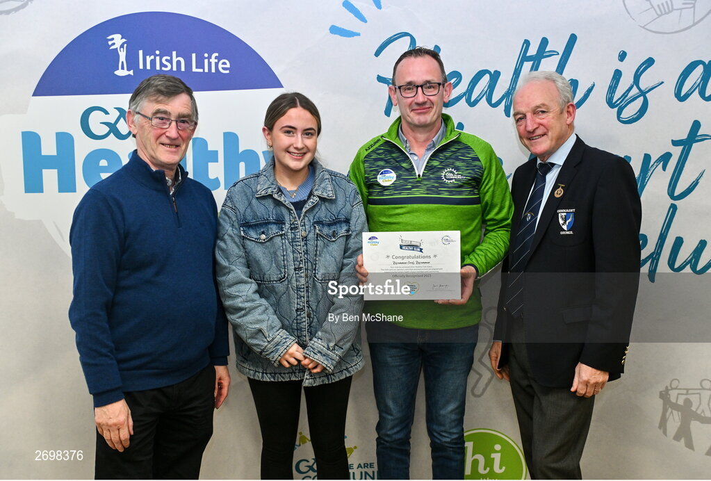 14 December 2023; Roscommon Gaels, Roscommon, representatives Aoibhe Mulry and Sean Mulry is presented their Silver Healthy Club award by Connacht GAA secretary John Prenty, left, and Connacht GAA Council president John Murphy, right, during the Irish Life Connacht GAA Healthy Clubs recognition event at the Connacht GAA Centre of Excellence in Bekan, Mayo. Photo by Ben McShane/Sportsfile