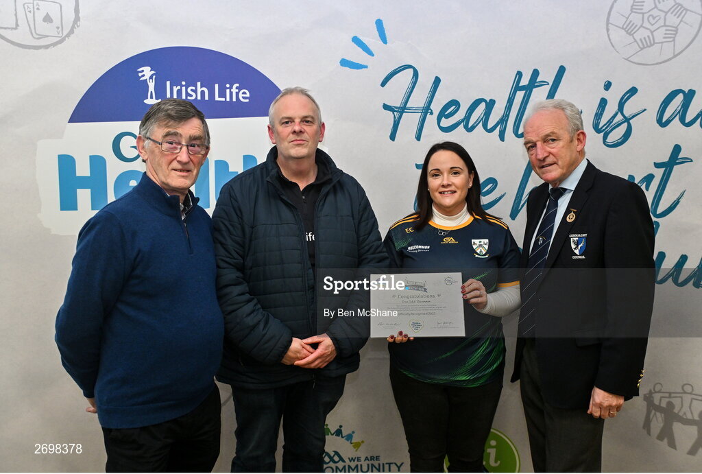 14 December 2023; Oran, Roscommon, representatives Alan Harrington and Edel Crehan is presented their Silver Healthy Club award by Connacht GAA secretary John Prenty, left, and Connacht GAA Council president John Murphy, right, during the Irish Life Connacht GAA Healthy Clubs recognition event at the Connacht GAA Centre of Excellence in Bekan, Mayo. Photo by Ben McShane/Sportsfile