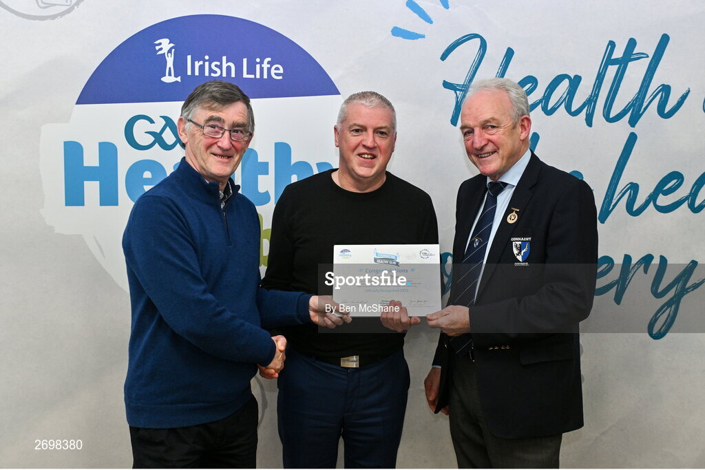 14 December 2023; Knockmore, Mayo, representative Tony Moyles is presented their Foundation Healthy Club award by Connacht GAA secretary John Prenty, left, and Connacht GAA Council president John Murphy, right, during the Irish Life Connacht GAA Healthy Clubs recognition event at the Connacht GAA Centre of Excellence in Bekan, Mayo. Photo by Ben McShane/Sportsfile