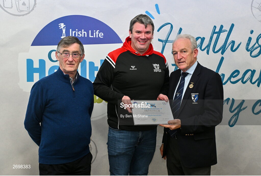 14 December 2023; Ballynote Round Towers, Sligo, representative Shane Rafferty is presented their Foundation Healthy Club award by Connacht GAA secretary John Prenty, left, and Connacht GAA Council president John Murphy, right, during the Irish Life Connacht GAA Healthy Clubs recognition event at the Connacht GAA Centre of Excellence in Bekan, Mayo. Photo by Ben McShane/Sportsfile