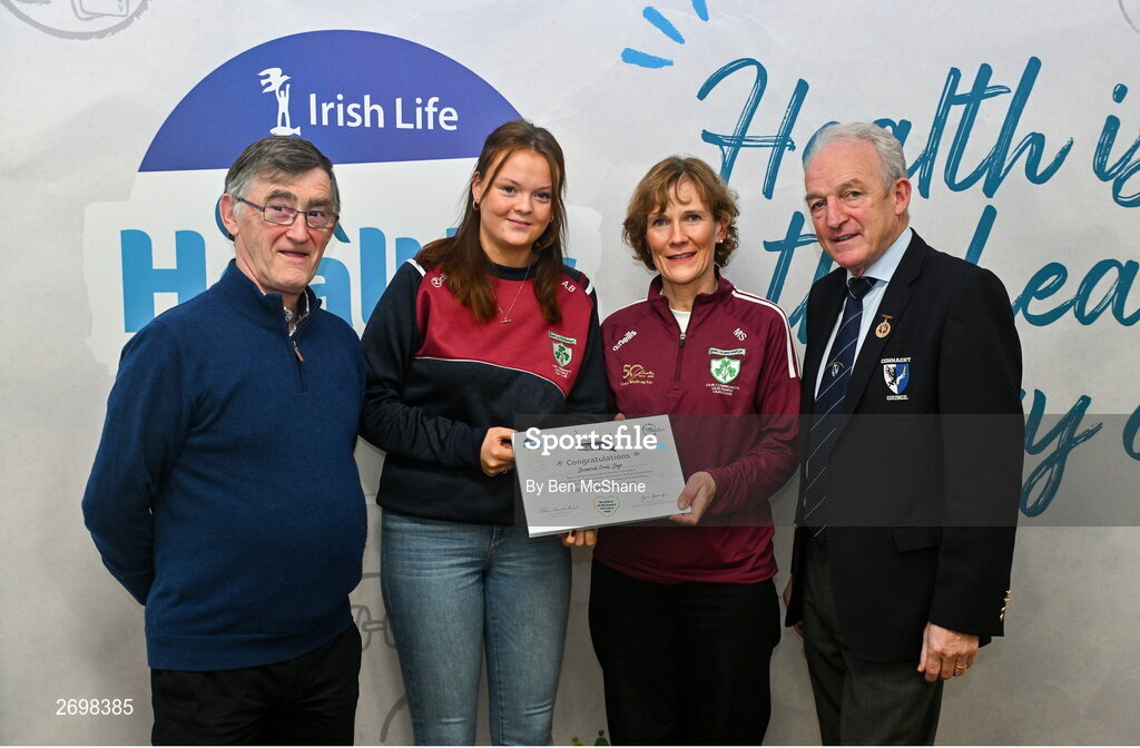 14 December 2023; Shamrock Gaels, Sligo, representatives Aine Brennan and Marina Swann is presented their Silver Healthy Club award by Connacht GAA secretary John Prenty, left, and Connacht GAA Council president John Murphy, right, during the Irish Life Connacht GAA Healthy Clubs recognition event at the Connacht GAA Centre of Excellence in Bekan, Mayo. Photo by Ben McShane/Sportsfile