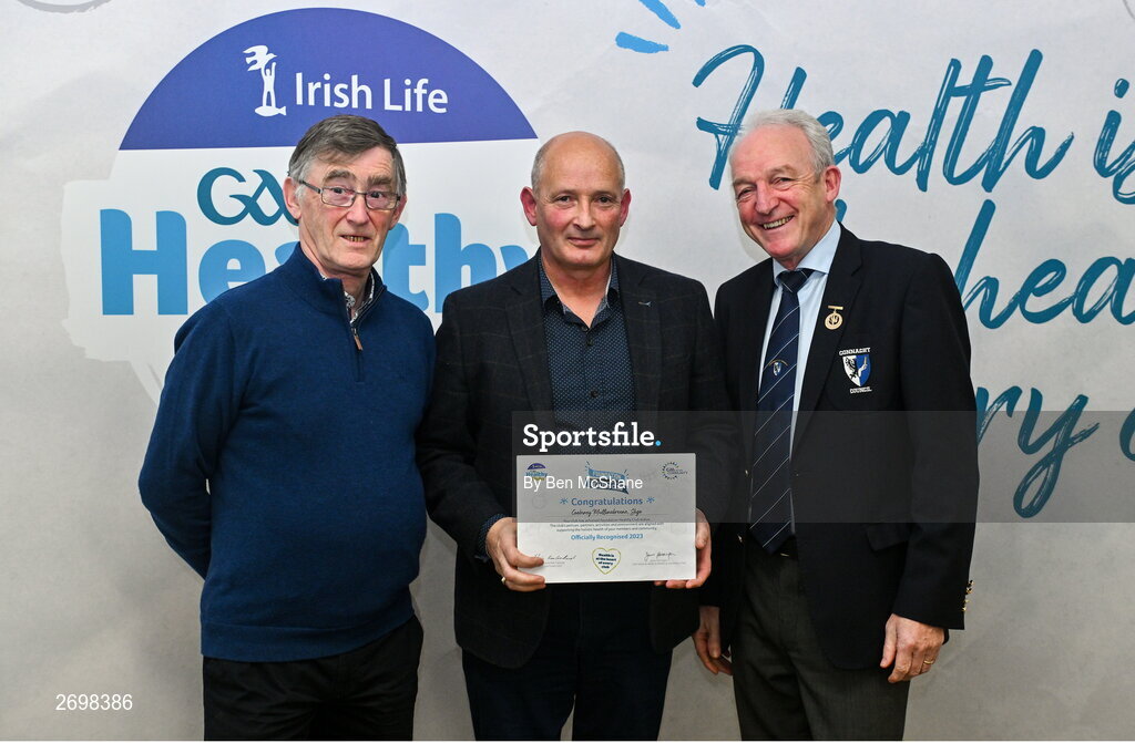14 December 2023; Coolaney/Mullinabreena, Sligo, representative Michael Gorman is presented their Foundation Healthy Club award by Connacht GAA secretary John Prenty, left, and Connacht GAA Council president John Murphy, right, during the Irish Life Connacht GAA Healthy Clubs recognition event at the Connacht GAA Centre of Excellence in Bekan, Mayo. Photo by Ben McShane/Sportsfile