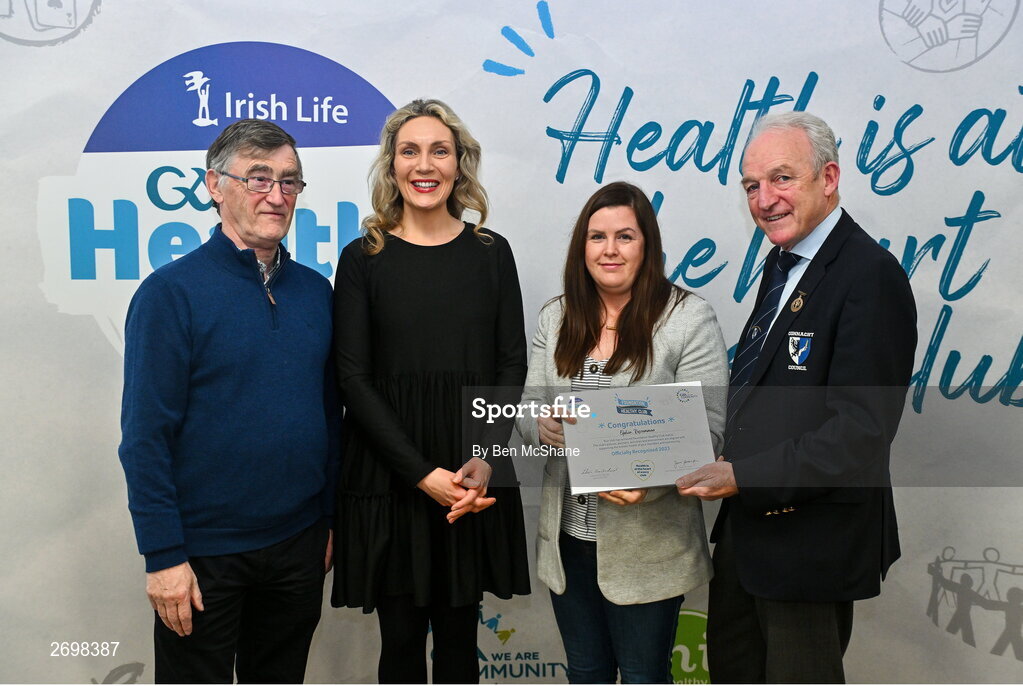 14 December 2023; Elphin, Roscommon, representatives Catríona Beirne and Aine Burke is presented their Foundation Healthy Club award by Connacht GAA secretary John Prenty, left, and Connacht GAA Council president John Murphy, right, during the Irish Life Connacht GAA Healthy Clubs recognition event at the Connacht GAA Centre of Excellence in Bekan, Mayo. Photo by Ben McShane/Sportsfile