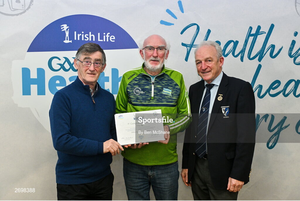14 December 2023; Curry, Sligo representative Pat Collins is presented their Silver Healthy Club award by Connacht GAA secretary John Prenty, left, and Connacht GAA Council president John Murphy, right, during the Irish Life Connacht GAA Healthy Clubs recognition event at the Connacht GAA Centre of Excellence in Bekan, Mayo. Photo by Ben McShane/Sportsfile