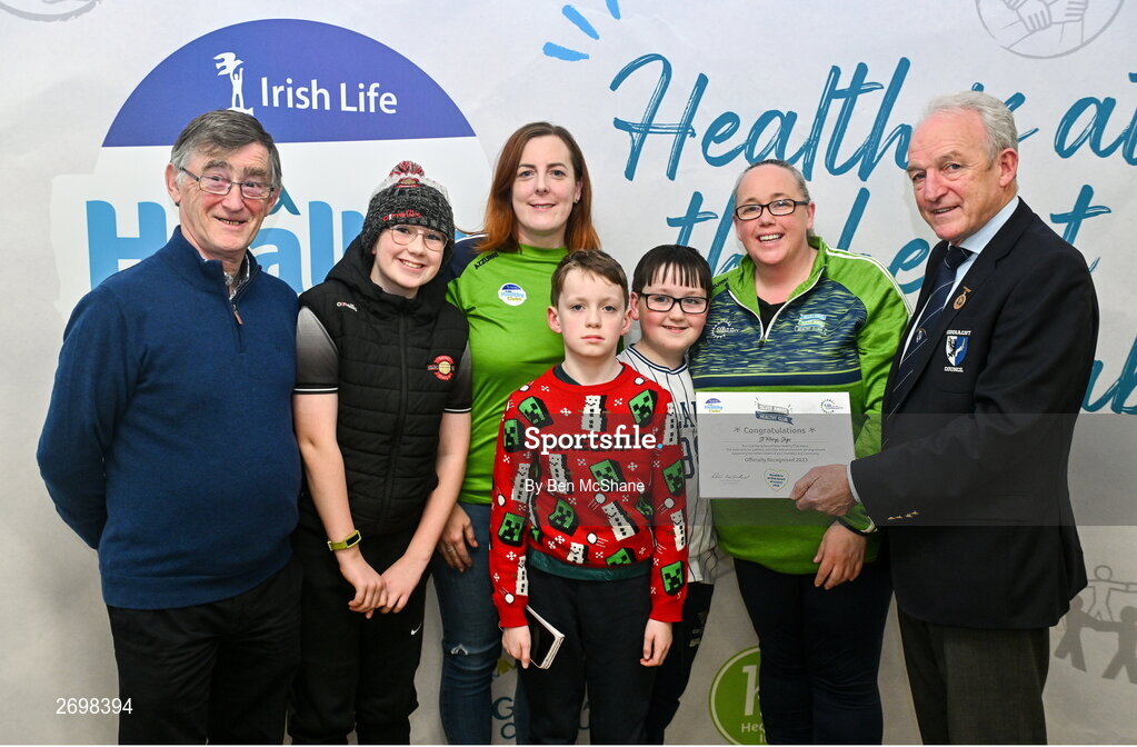 14 December 2023; St Mary's, Sligo, representatives Maggie Heylin, Bernadine Heylin and children Joe, Rory and Tommy are presented their Silver Healthy Club award by Connacht GAA secretary John Prenty, left, and Connacht GAA Council president John Murphy, right, during the Irish Life Connacht GAA Healthy Clubs recognition event at the Connacht GAA Centre of Excellence in Bekan, Mayo. Photo by Ben McShane/Sportsfile