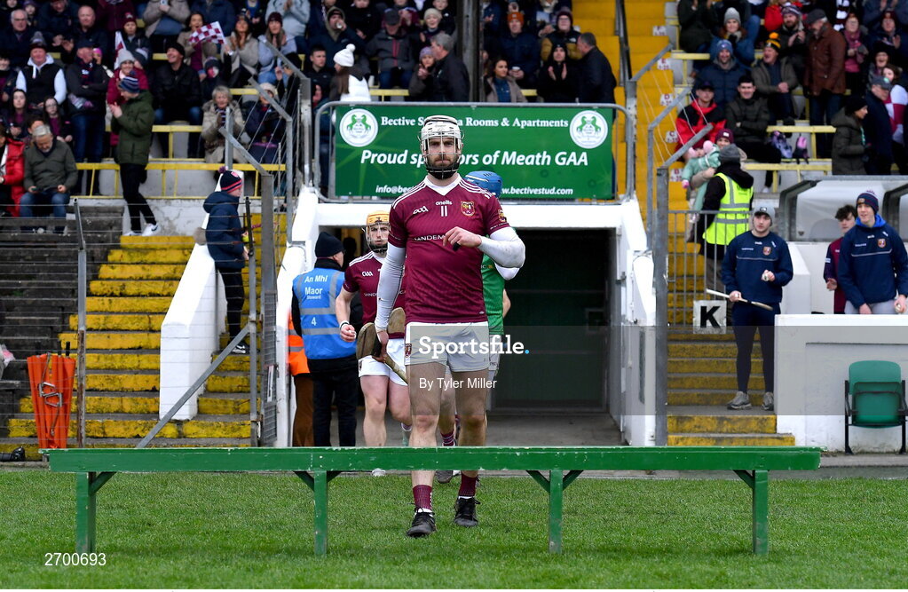 17 December 2023; Neil McManus of Ruairí Óg Cushendall leads his side out for the team photograph before the AIB GAA Hurling All-Ireland Club Championship semi-final match between O'Loughlin Gaels, Kilkenny, and Ruairí Óg Cushendall, Antrim, at Páirc Tailteann in Navan, Meath. Photo by Tyler Miller/Sportsfile