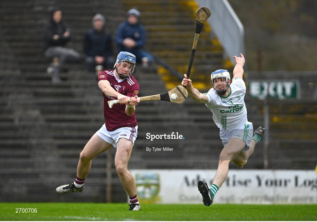 17 December 2023; Joseph McLaughlin of Ruairí Óg Cushendall shoots to score his side's first goal despite the efforts of Huw Lawlor of O’Loughlin Gaels during the AIB GAA Hurling All-Ireland Club Championship semi-final match between O'Loughlin Gaels, Kilkenny, and Ruairí Óg Cushendall, Antrim, at Páirc Tailteann in Navan, Meath. Photo by Tyler Miller/Sportsfile