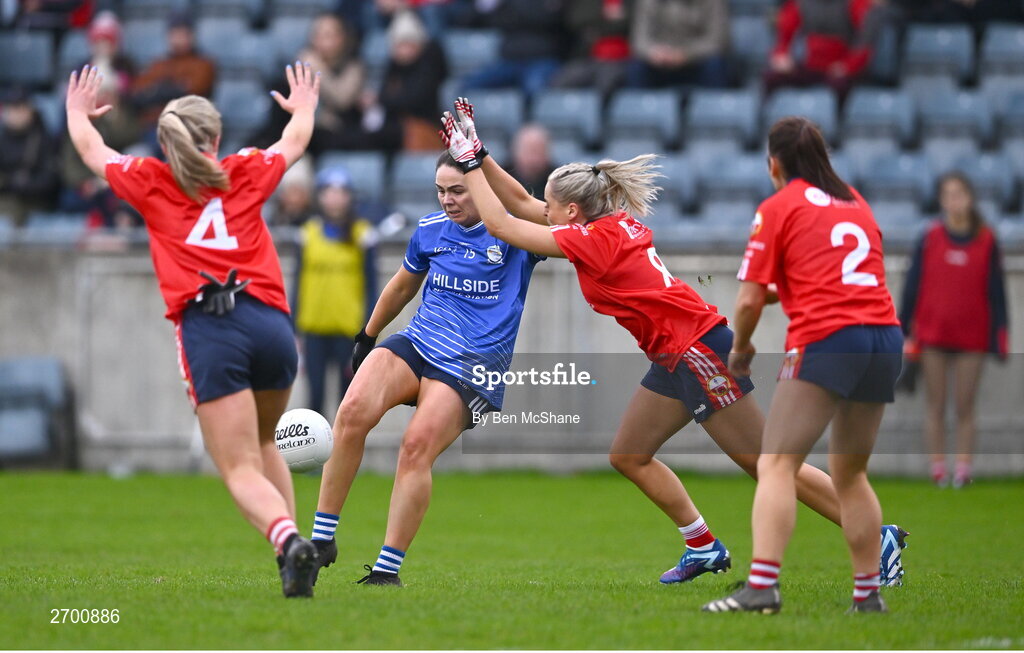 17 December 2023; Laura Kelly of Claremorris kicks a point despite the attention of O'Donovan Rossa players, from left, Allie Tobin, Laura O'Mahony and Michelle Donelan during the Currentaccount.ie LGFA All-Ireland Junior Club Championship final match between Claremorris of Mayo and O'Donovan Rossa of Cork at Parnell Park in Dublin. Photo by Ben McShane/Sportsfile