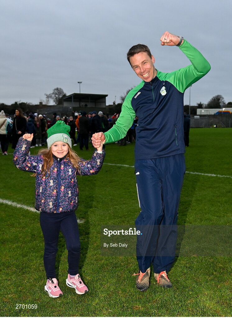 17 December 2023; O'Loughlin Gaels manager Brian Hogan and his daughter Rachel, age six, celebrate after their side's victory in the AIB GAA Hurling All-Ireland Club Championship semi-final match between O'Loughlin Gaels, Kilkenny, and Ruairí Óg Cushendall, Antrim, at Páirc Tailteann in Navan, Meath. Photo by Seb Daly/Sportsfile