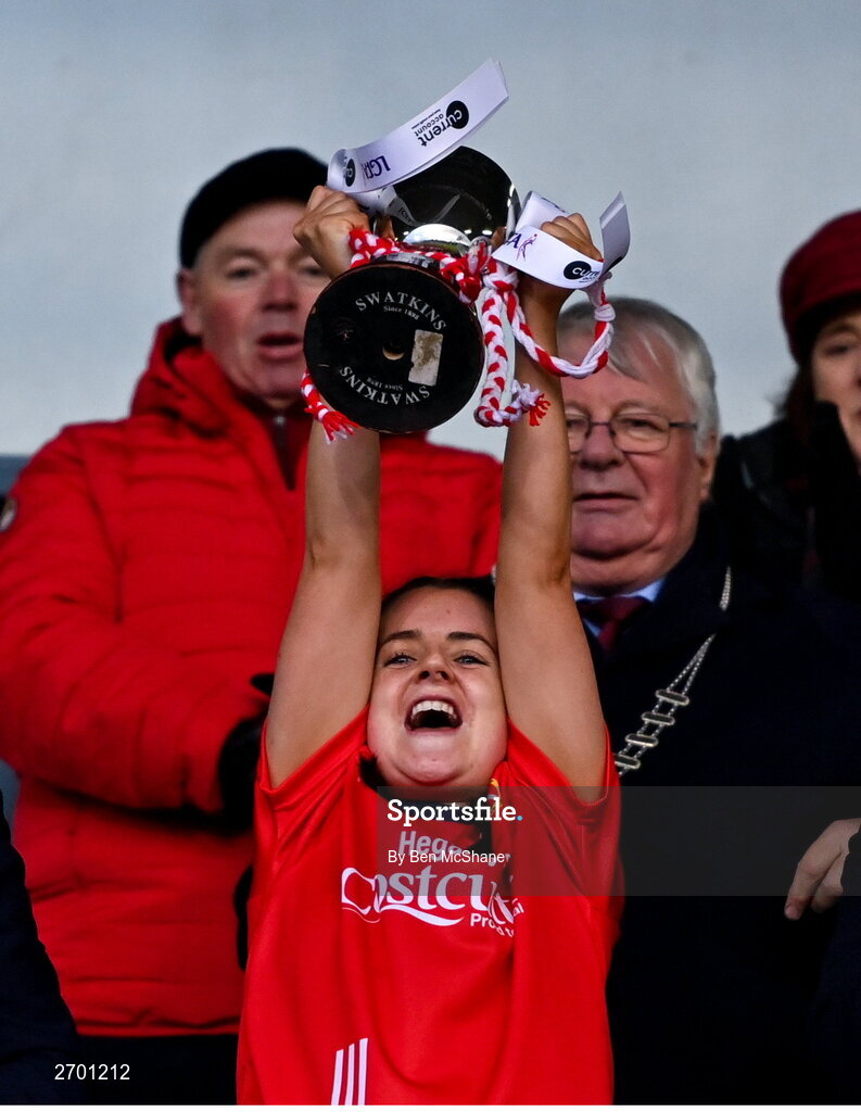 17 December 2023; O'Donovan Rossa captain Lisa Harte lifts the cup after during the Currentaccount.ie LGFA All-Ireland Junior Club Championship final match between Claremorris of Mayo and O'Donovan Rossa of Cork at Parnell Park in Dublin. Photo by Ben McShane/Sportsfile