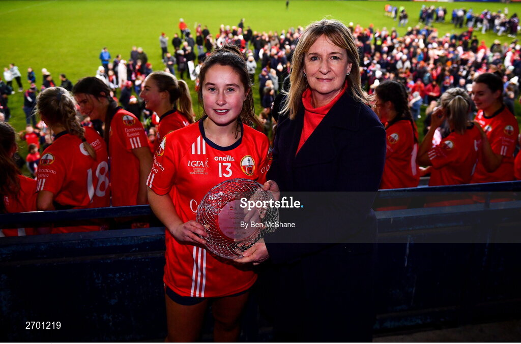 17 December 2023; Éabha O'Donovan of O'Donovan Rossa receives the Player of the Match award from Dorothy Gallagher, Business Development & Relationship Manager, Payac, on behalf of competition sponsors currentaccount.ie, after the Currentaccount.ie LGFA All-Ireland Junior Club Championship final match between Claremorris of Mayo and O'Donovan Rossa of Cork at Parnell Park in Dublin. Photo by Ben McShane/Sportsfile