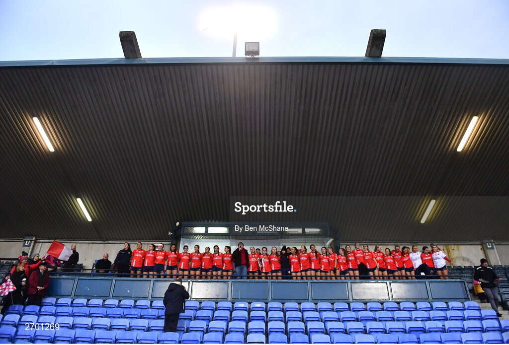 17 December 2023; O'Donovan Rossa players and supporter Matthew Salter sing 'Dear Old Skibbereen' after their victory the Currentaccount.ie LGFA All-Ireland Junior Club Championship final match between Claremorris of Mayo and O'Donovan Rossa of Cork at Parnell Park in Dublin. Photo by Ben McShane/Sportsfile