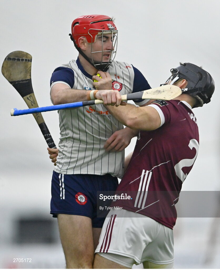 4 January 2024; AJ Willis of New York and MacDara Ó'Bearra of Galway tussle during the Connacht Hurling League semi-final match between Galway and New York at University of Galway Connacht GAA AirDome in Bekan, Mayo. Photo by Tyler Miller/Sportsfile
