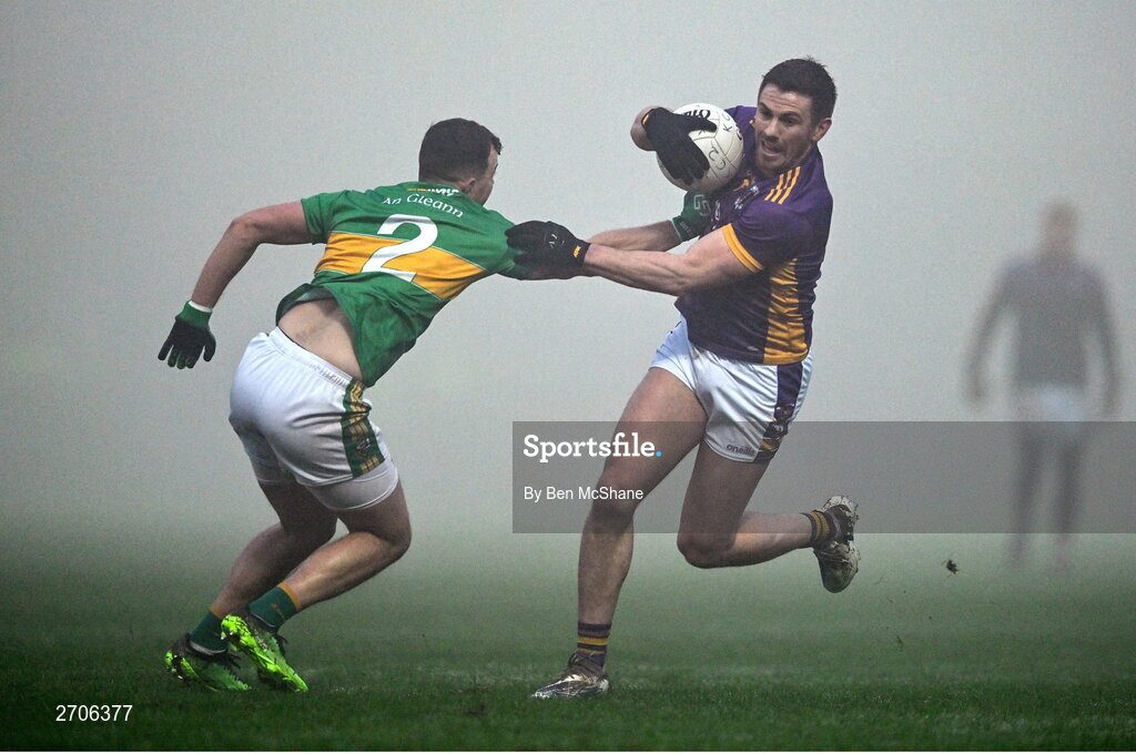 7 January 2024; Shane Walsh of Kilmacud Crokes is tackled by Michael Warnock of Glen during the AIB GAA Football All-Ireland Senior Club Championship semi-final match between Kilmacud Crokes of Dublin, and Glen of Derry, at Páirc Esler in Newry, Down. Photo by Ben McShane/Sportsfile