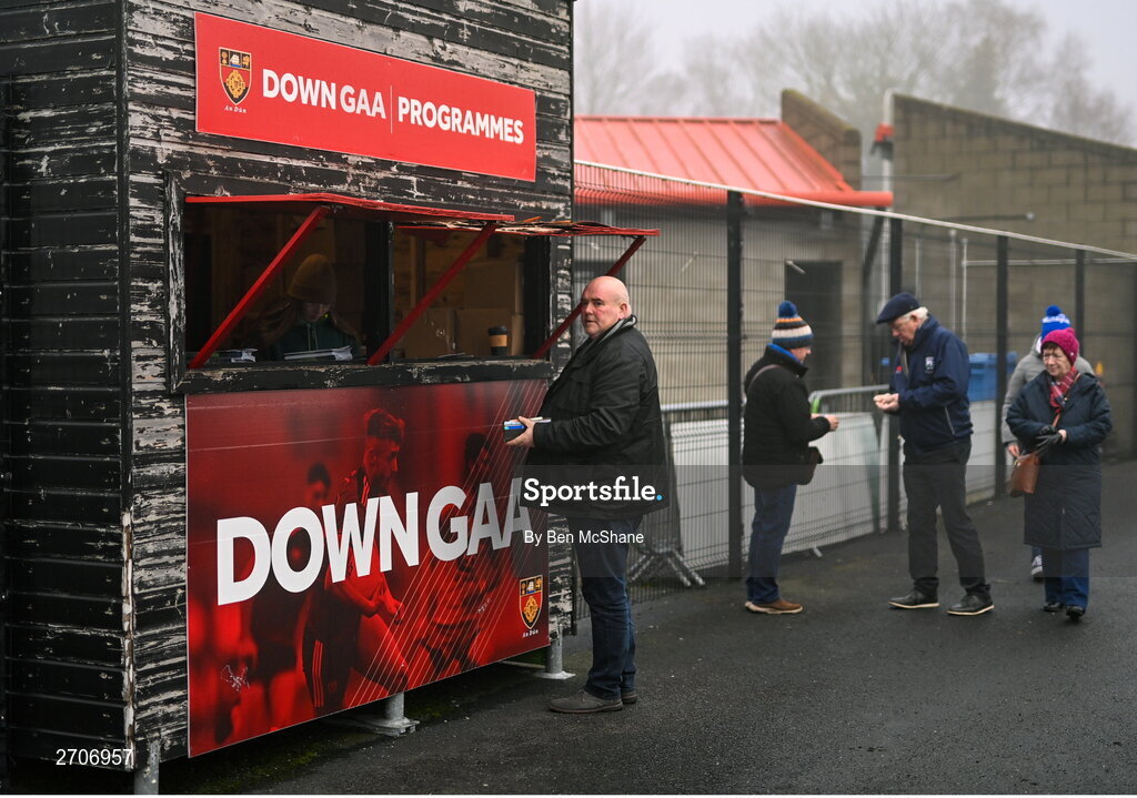 7 January 2024; A supporter purchases a match programme before the AIB GAA Football All-Ireland Senior Club Championship semi-final match between Kilmacud Crokes of Dublin, and Glen of Derry, at Páirc Esler in Newry, Down. Photo by Ben McShane/Sportsfile