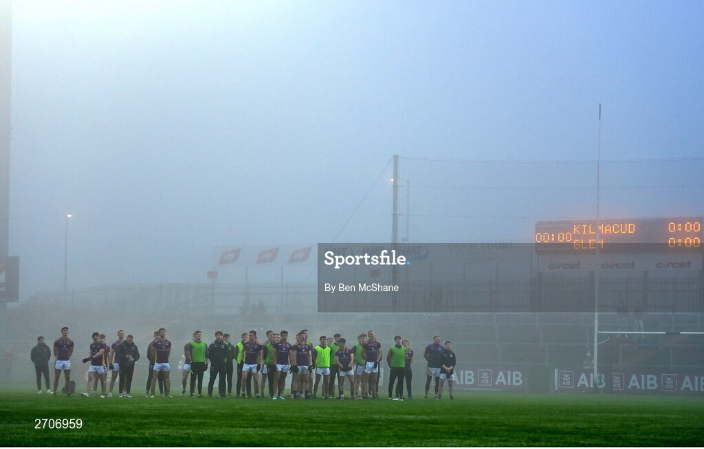 7 January 2024; Kilmacud Crokes players stand amongst the fog for the national anthem before the AIB GAA Football All-Ireland Senior Club Championship semi-final match between Kilmacud Crokes of Dublin, and Glen of Derry, at Páirc Esler in Newry, Down. Photo by Ben McShane/Sportsfile