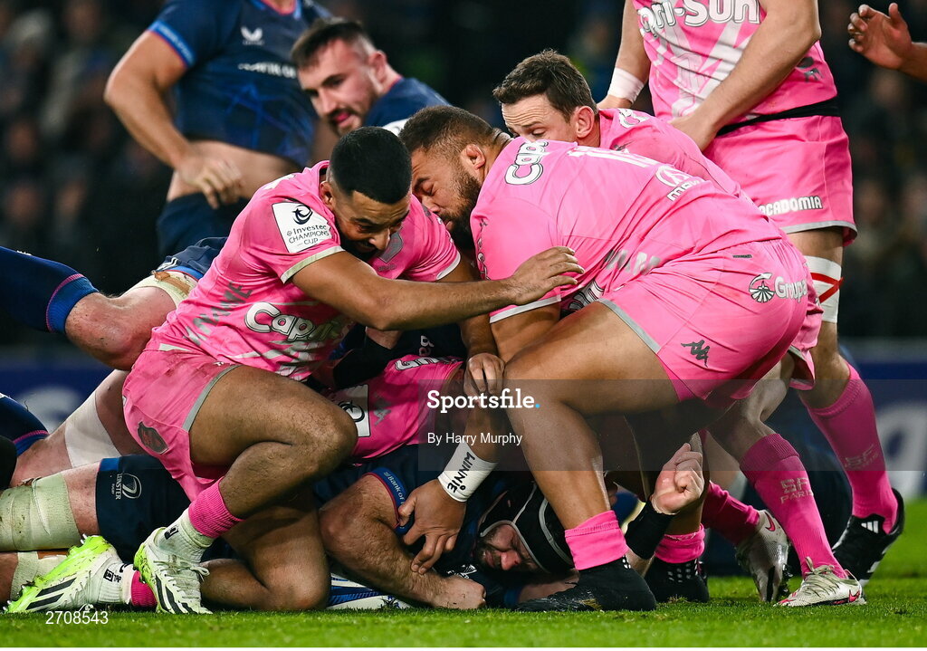 13 January 2024; Caelan Doris of Leinster dives over to score his side's sixth try despite the tackle of Zack Henry and Paul Alo-Emile of Stade Francais during the Investec Champions Cup Pool 4 Round 3 match between Leinster and Stade Francais at the Aviva Stadium in Dublin. Photo by Harry Murphy/Sportsfile