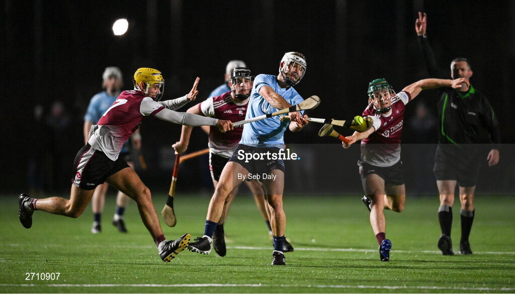 18 January 2024; Chris Nolan of SETU Carlow scores a point under pressure from University of Galway players Tiernan Killeen, left, and Gavin Lee during the Electric Ireland Higher Education GAA Fitzgibbon Cup Round 1 match between SETU Carlow and University of Galway at SETU Carlow Sport Complex in Carlow. Photo by Seb Daly/Sportsfile