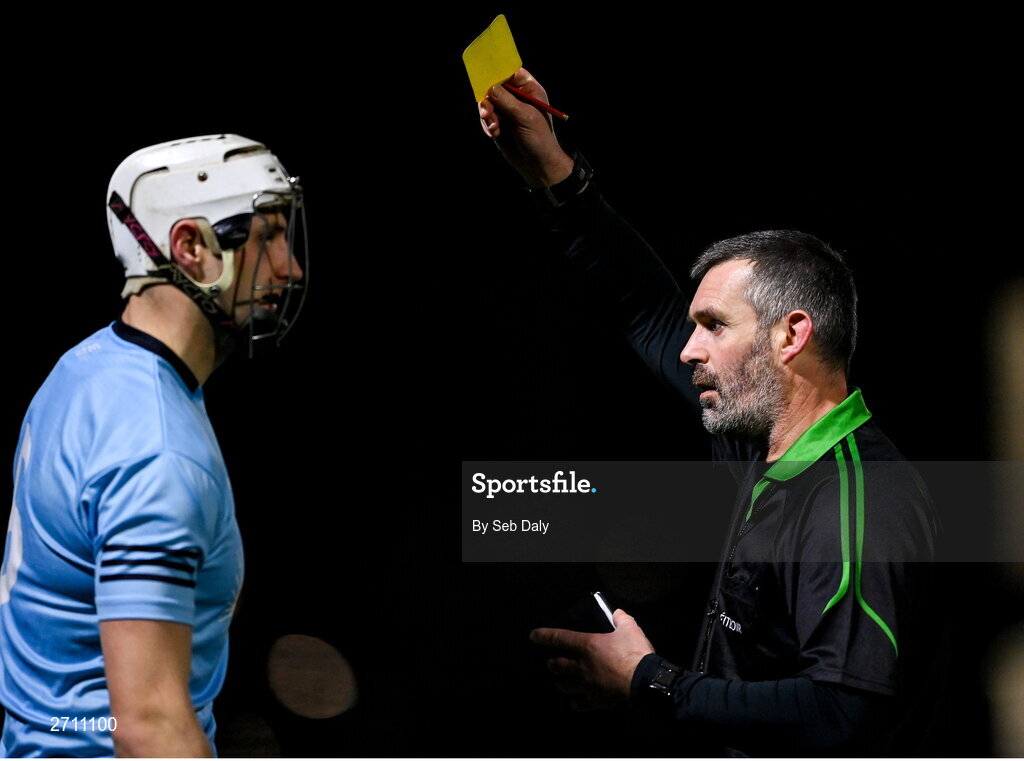 18 January 2024; Referee James Owens shows a yellow card to Ryan Mullaney of SETU Carlow during the Electric Ireland Higher Education GAA Fitzgibbon Cup Round 1 match between SETU Carlow and University of Galway at SETU Carlow Sport Complex in Carlow. Photo by Seb Daly/Sportsfile