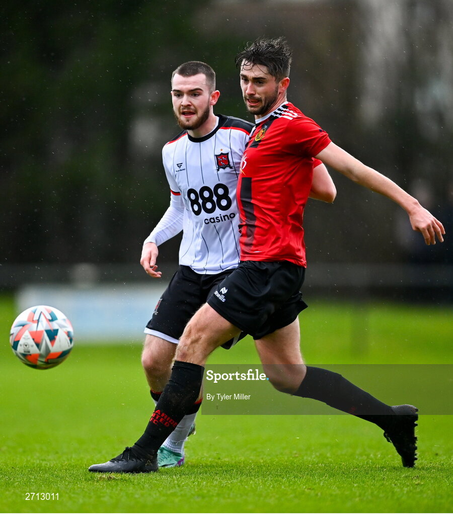 21 January 2024; Robert Mahon of Dundalk in action against Robbie Byrne of Malahide United AFC during the PTSB Leinster Senior Cup Group A match between Malahide United and Dundalk at Gannon Park in Malahide, Dublin. Photo by Tyler Miller/Sportsfile