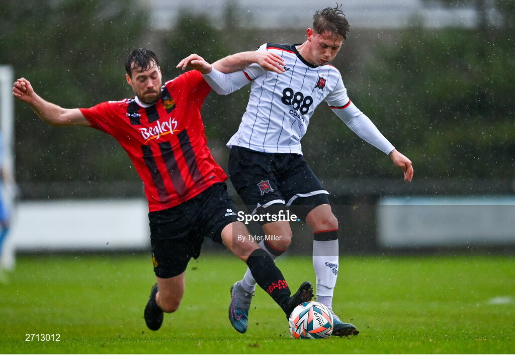21 January 2024; Hayden Muller of Dundalk is tackled by Stephen Cleary of Malahide United AFC during the PTSB Leinster Senior Cup Group A match between Malahide United and Dundalk at Gannon Park in Malahide, Dublin. Photo by Tyler Miller/Sportsfile