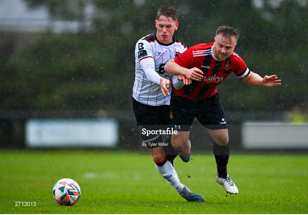 21 January 2024; Hayden Muller of Dundalk is tackled by Jordan Briggs of Malahide United AFC during the PTSB Leinster Senior Cup Group A match between Malahide United and Dundalk at Gannon Park in Malahide, Dublin. Photo by Tyler Miller/Sportsfile