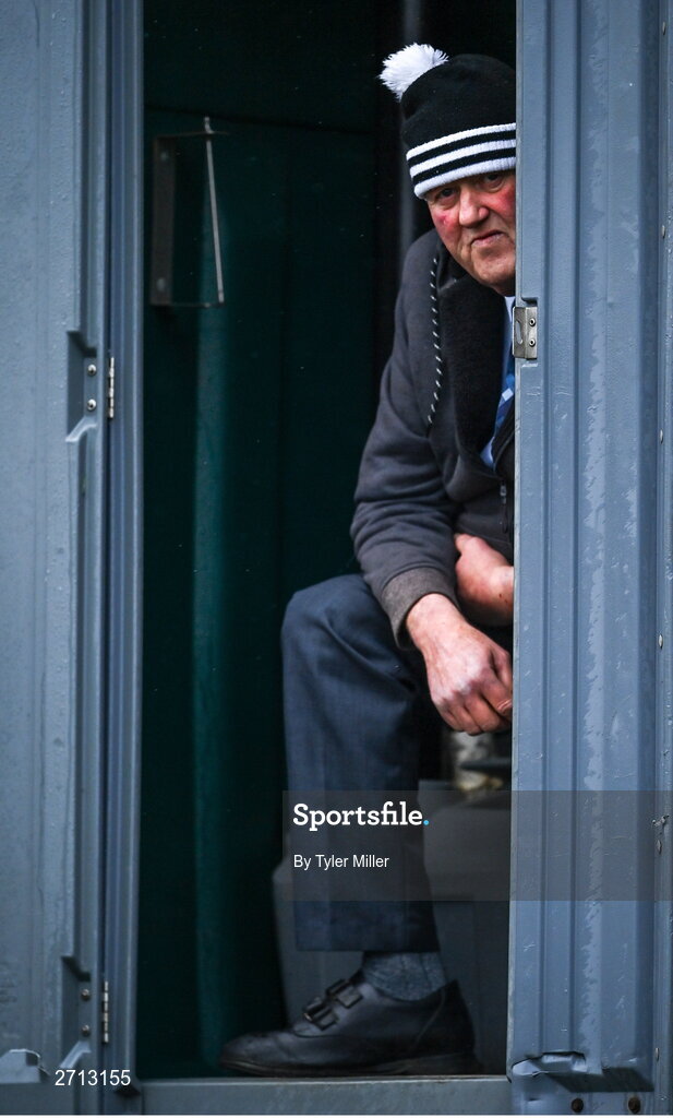 21 January 2024; A supporter shelters from the rain during the PTSB Leinster Senior Cup Group A match between Malahide United and Dundalk at Gannon Park in Malahide, Dublin. Photo by Tyler Miller/Sportsfile