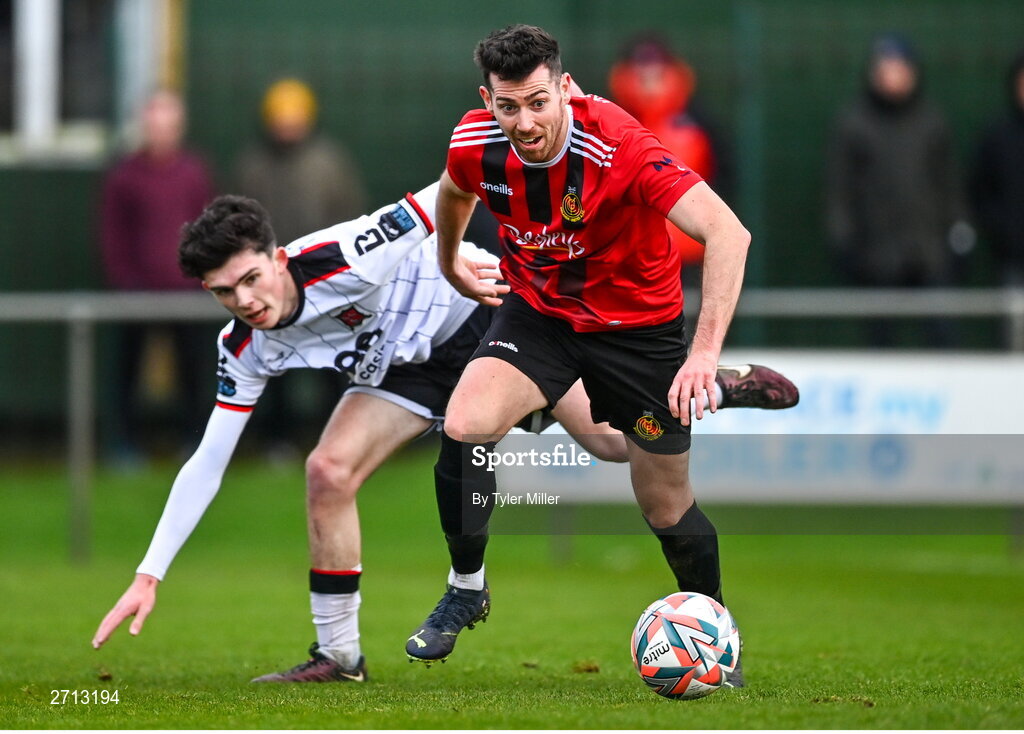 21 January 2024; Alan O'Shaughnessy of Malahide United AFC in action against Luke Mulligan of Dundalk during the PTSB Leinster Senior Cup Group A match between Malahide United and Dundalk at Gannon Park in Malahide, Dublin. Photo by Tyler Miller/Sportsfile
