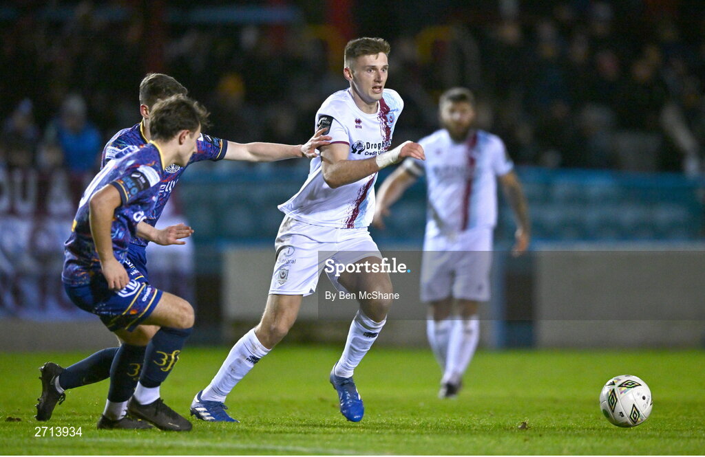 22 January 2024; Hayden Cann of Drogheda United in action against Sean Moore, behind, and Taylor Mooney of Bohemians during the PTSB Leinster Senior Cup Group A match between Drogheda United and Bohemians at Weaver's Park in Drogheda, Louth. Photo by Ben McShane/Sportsfile