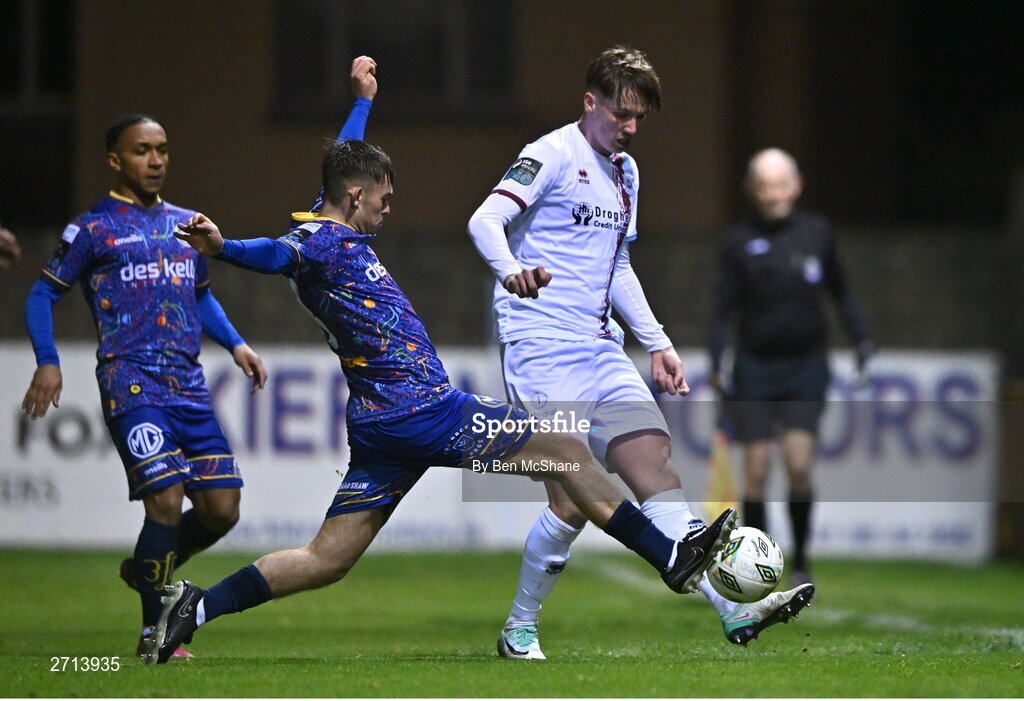 22 January 2024; Oisin Gallagher of Drogheda United in action against Billy Gilmore of Bohemians during the PTSB Leinster Senior Cup Group A match between Drogheda United and Bohemians at Weaver's Park in Drogheda, Louth. Photo by Ben McShane/Sportsfile
