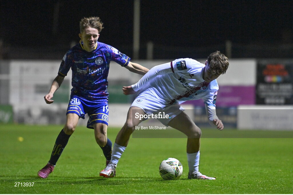 22 January 2024; Emre Topcu of Drogheda United in action against Rhys Brennan Black of Bohemians during the PTSB Leinster Senior Cup Group A match between Drogheda United and Bohemians at Weaver's Park in Drogheda, Louth. Photo by Ben McShane/Sportsfile