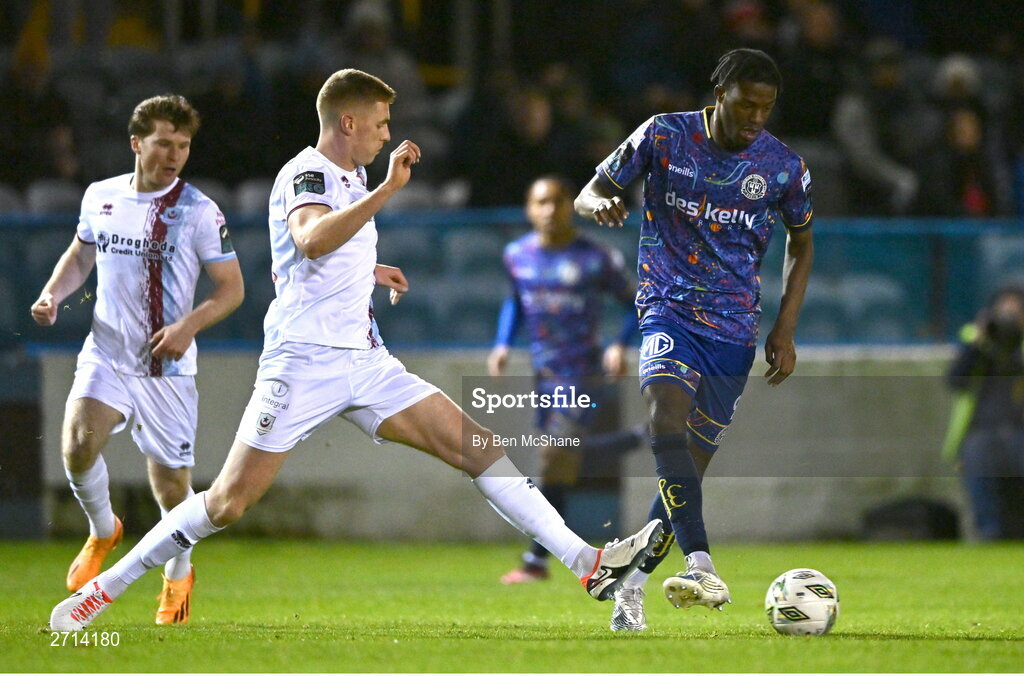 22 January 2024; Onesime Tembe of Bohemians and Jack Keaney of Drogheda United during the PTSB Leinster Senior Cup Group A match between Drogheda United and Bohemians at Weaver's Park in Drogheda, Louth. Photo by Ben McShane/Sportsfile