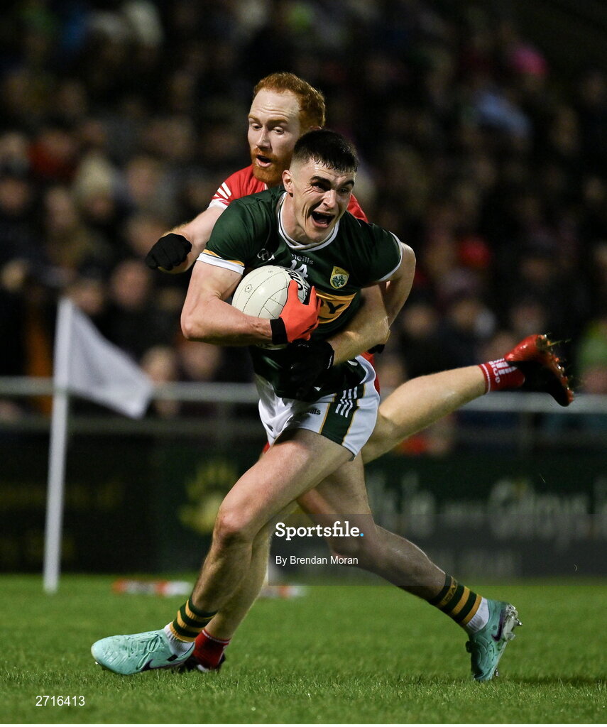 27 January 2024; Sean O'Shea of Kerry is tackled by Conor Glass of Derry during the Allianz Football League Division 1 match between Kerry and Derry at Austin Stack Park in Tralee, Kerry. Photo by Brendan Moran/Sportsfile