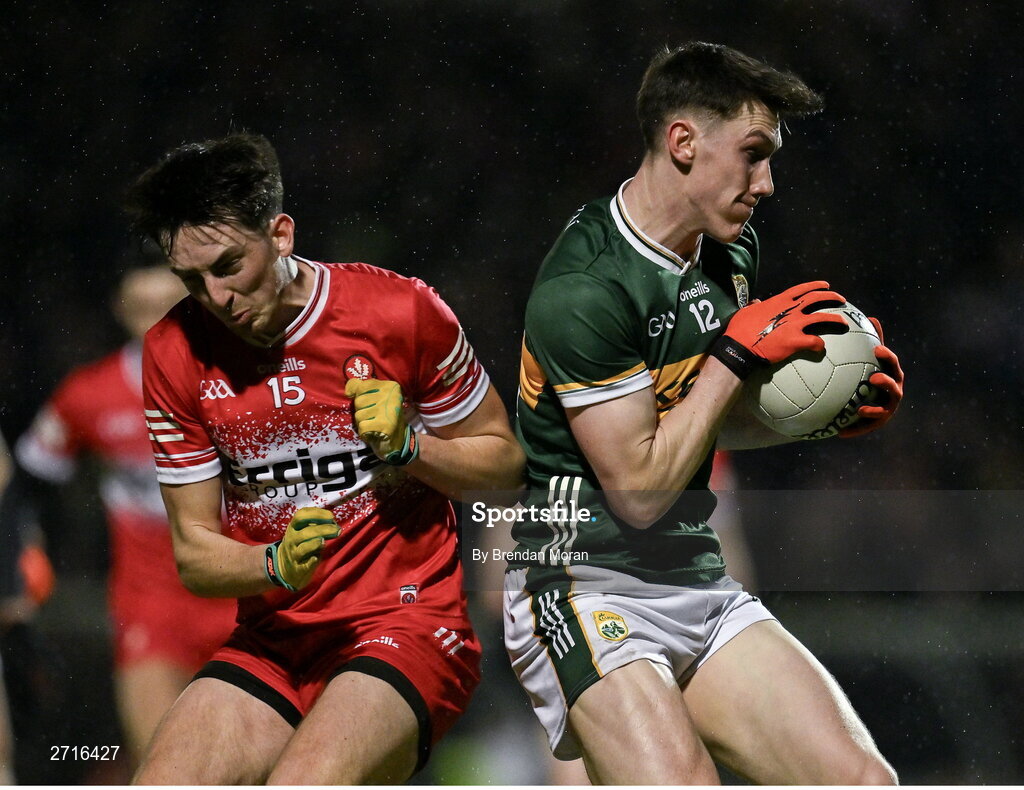 27 January 2024; Cillian Burke of Kerry in action against Paul Cassidy of Derry during the Allianz Football League Division 1 match between Kerry and Derry at Austin Stack Park in Tralee, Kerry. Photo by Brendan Moran/Sportsfile