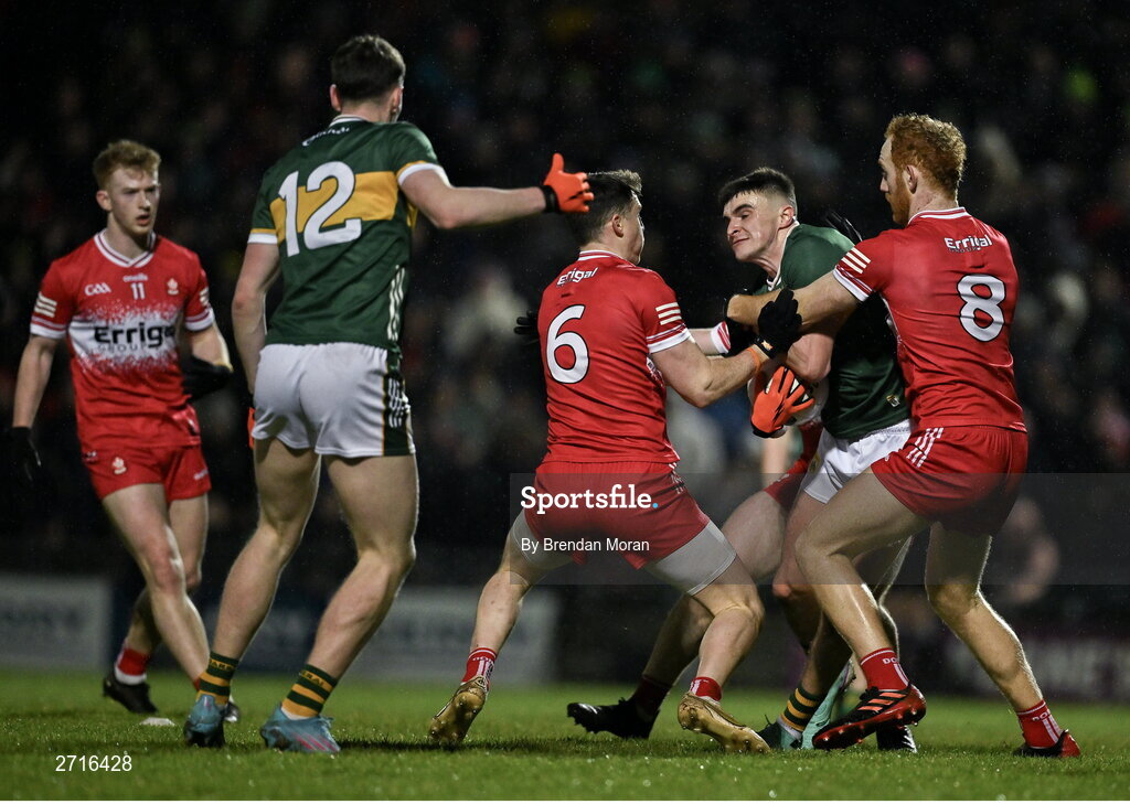 27 January 2024; Sean O'Shea of Kerry in action against Derry players Gareth McKinless, Padraig McGrogan and Conor Glass during the Allianz Football League Division 1 match between Kerry and Derry at Austin Stack Park in Tralee, Kerry. Photo by Brendan Moran/Sportsfile