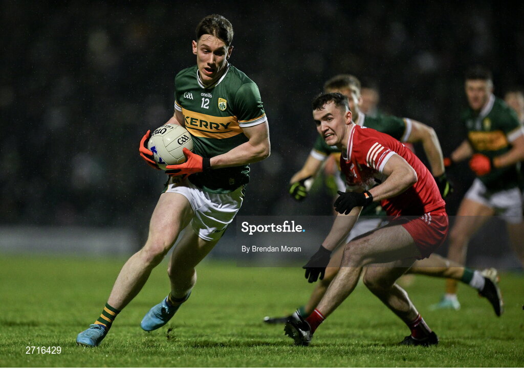 27 January 2024; Cillian Burke of Kerry in action against Diarmuid Baker of Derry during the Allianz Football League Division 1 match between Kerry and Derry at Austin Stack Park in Tralee, Kerry. Photo by Brendan Moran/Sportsfile