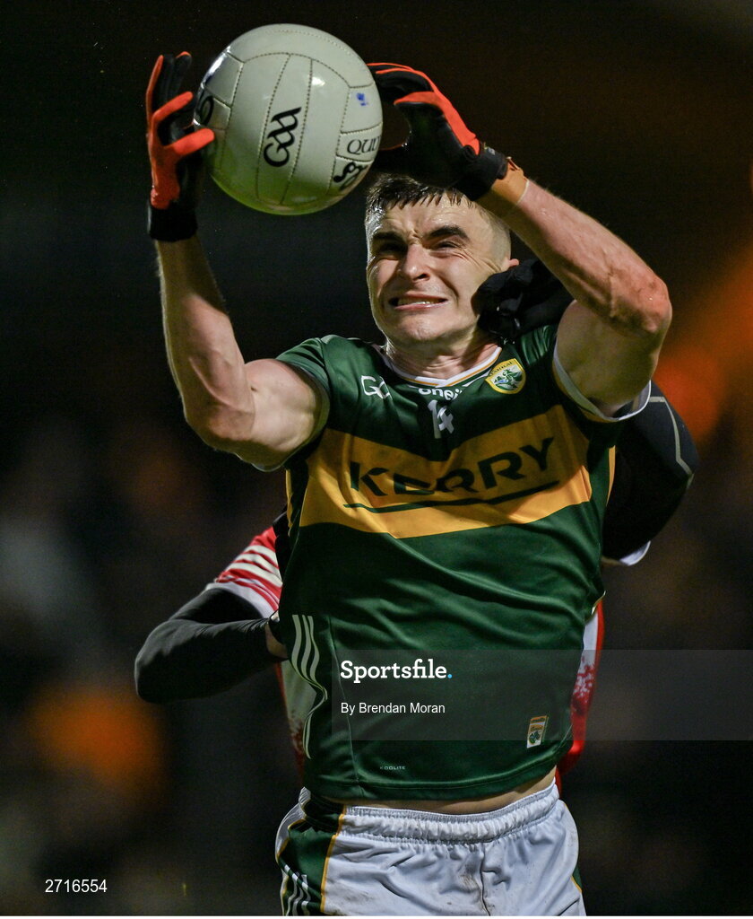 27 January 2024; Sean O'Shea of Kerry is tackled by Christopher McKaigue of Derry during the Allianz Football League Division 1 match between Kerry and Derry at Austin Stack Park in Tralee, Kerry. Photo by Brendan Moran/Sportsfile