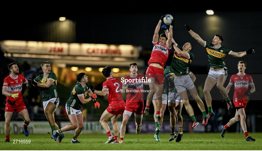 27 January 2024; Shane McGuigan of Derry catches a kickout ahead of Jason Foley and Diarmuid O'Connor of Kerry during the Allianz Football League Division 1 match between Kerry and Derry at Austin Stack Park in Tralee, Kerry. Photo by Brendan Moran/Sportsfile