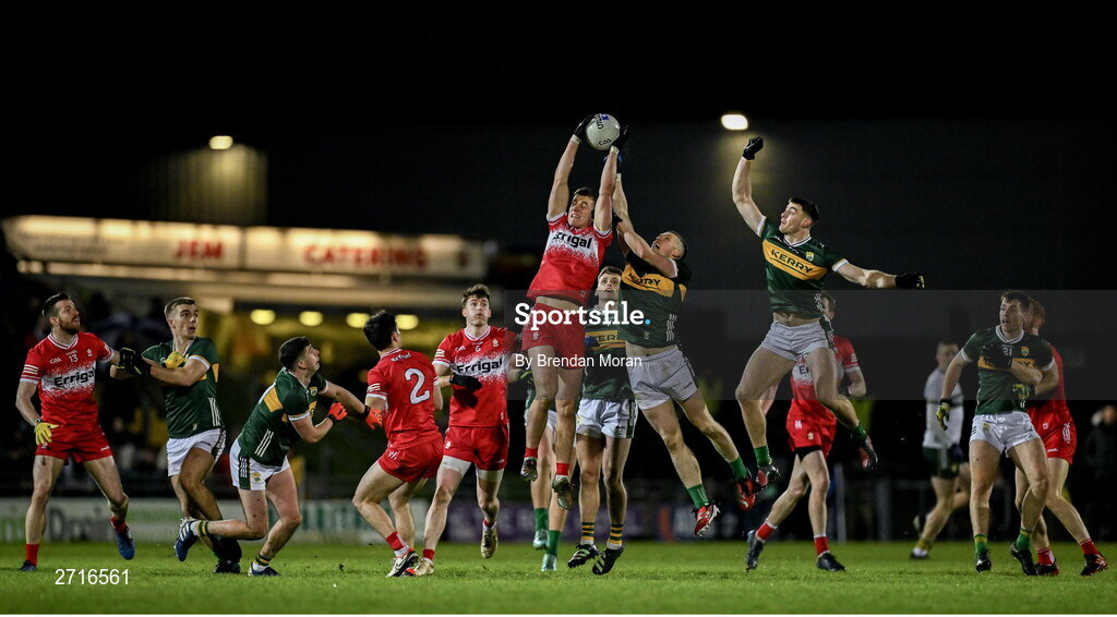 27 January 2024; Shane McGuigan of Derry catches a kickout ahead of Jason Foley and Diarmuid O'Connor of Kerry during the Allianz Football League Division 1 match between Kerry and Derry at Austin Stack Park in Tralee, Kerry. Photo by Brendan Moran/Sportsfile