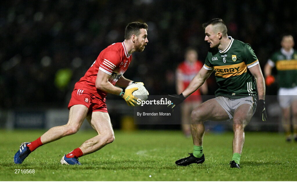 27 January 2024; Niall Loughlin of Derry in action against Tom O'Sullivan of Kerry during the Allianz Football League Division 1 match between Kerry and Derry at Austin Stack Park in Tralee, Kerry. Photo by Brendan Moran/Sportsfile