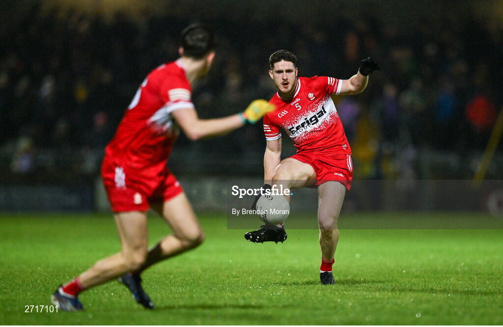 27 January 2024; Padraig McGrogan of Derry passes the ball to teammate Niall Loughlin during the Allianz Football League Division 1 match between Kerry and Derry at Austin Stack Park in Tralee, Kerry. Photo by Brendan Moran/Sportsfile