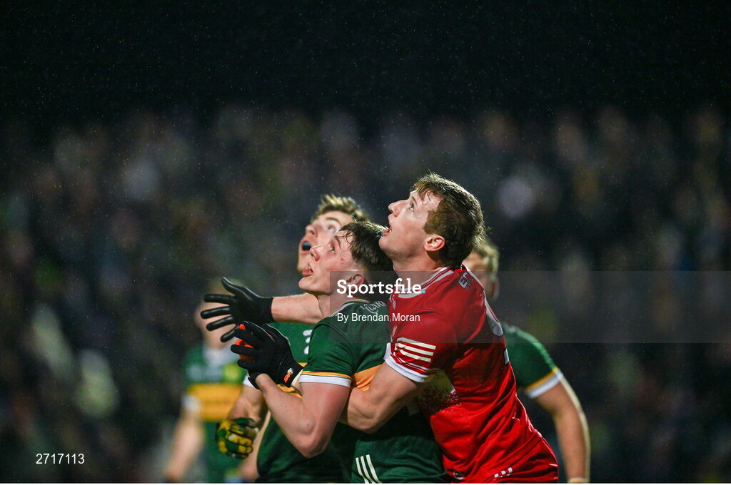 27 January 2024; Brendan Rogers of Derry and Cillian Burke of Kerry watch a dropping ball during the Allianz Football League Division 1 match between Kerry and Derry at Austin Stack Park in Tralee, Kerry. Photo by Brendan Moran/Sportsfile