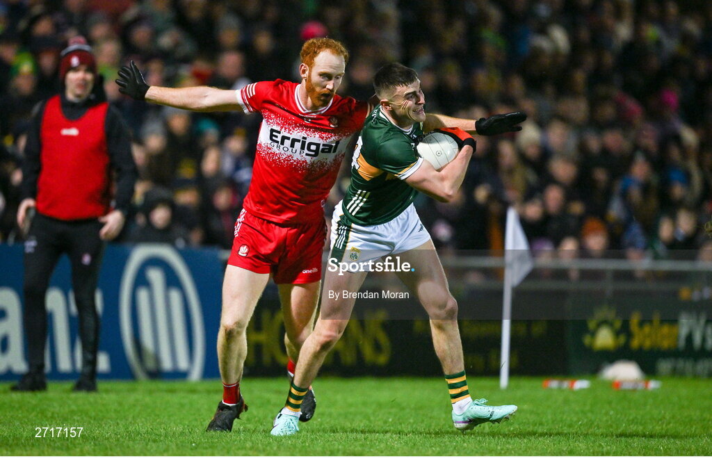 27 January 2024; Sean O'Shea of Kerry is tackled by Conor Glass of Derry during the Allianz Football League Division 1 match between Kerry and Derry at Austin Stack Park in Tralee, Kerry. Photo by Brendan Moran/Sportsfile