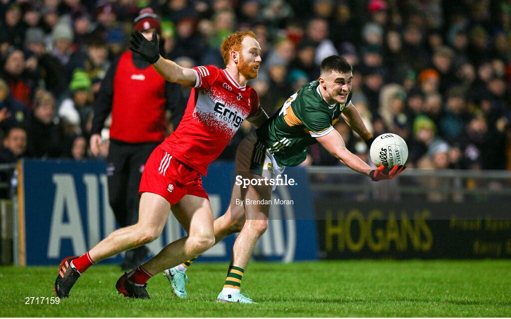 27 January 2024; Sean O'Shea of Kerry is tackled by Conor Glass of Derry during the Allianz Football League Division 1 match between Kerry and Derry at Austin Stack Park in Tralee, Kerry. Photo by Brendan Moran/Sportsfile
