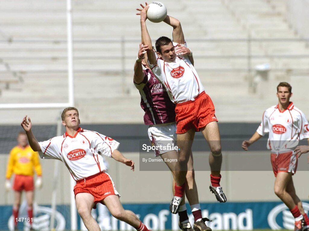 17 July 2004; Tyrone's Joe McMahon claims the ball from Galway's Sean O'Domhnaill. Bank of Ireland Senior Football Championship Qualifier, Round 3, Tyrone v Galway, Croke Park, Dublin. Picture credit; Damien Eagers / SPORTSFILE