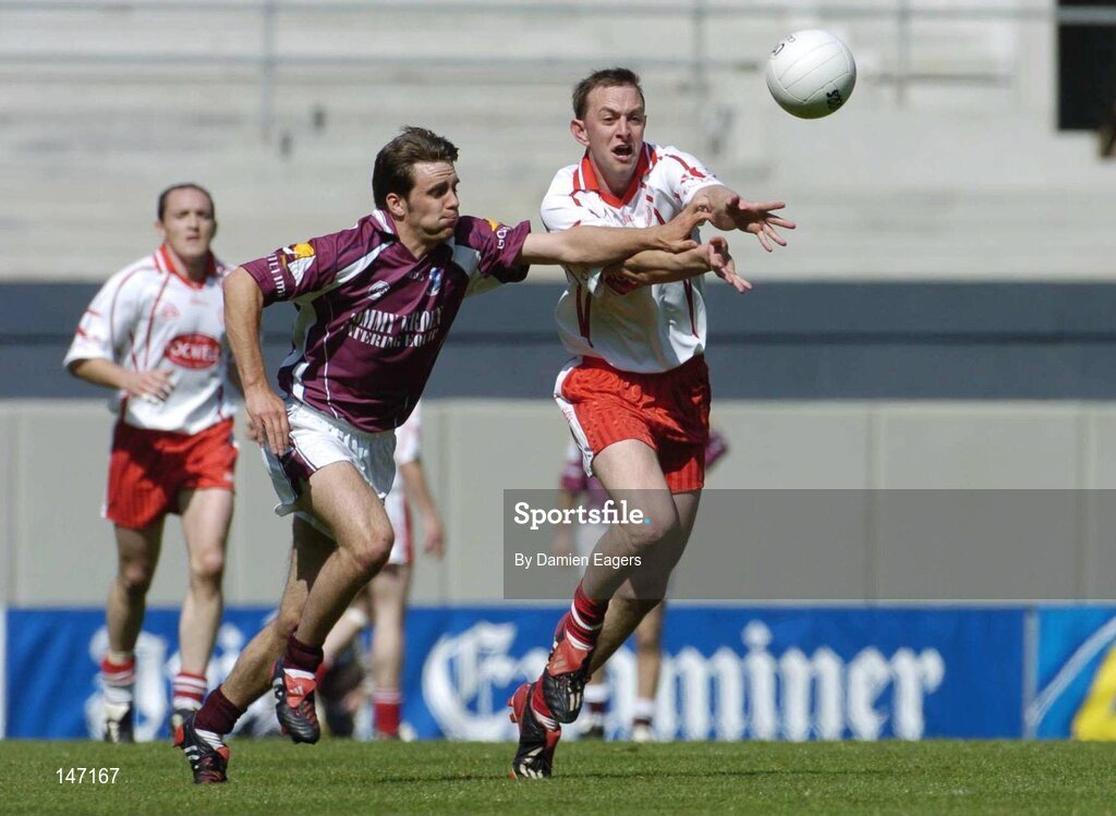17 July 2004; Gerard Cavlan, Tyrone, in action against Matthew Clancy, Galway. Bank of Ireland Senior Football Championship Qualifier, Round 3, Tyrone v Galway, Croke Park, Dublin. Picture credit; Damien Eagers / SPORTSFILE