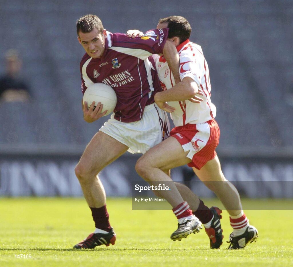 17 July 2004; Damien Burke, Galway, is tackled by Brian Dooher, Tyrone. Bank of Ireland Senior Football Championship Qualifier, Round 3, Tyrone v Galway, Croke Park, Dublin. Picture credit; Ray McManus / SPORTSFILE