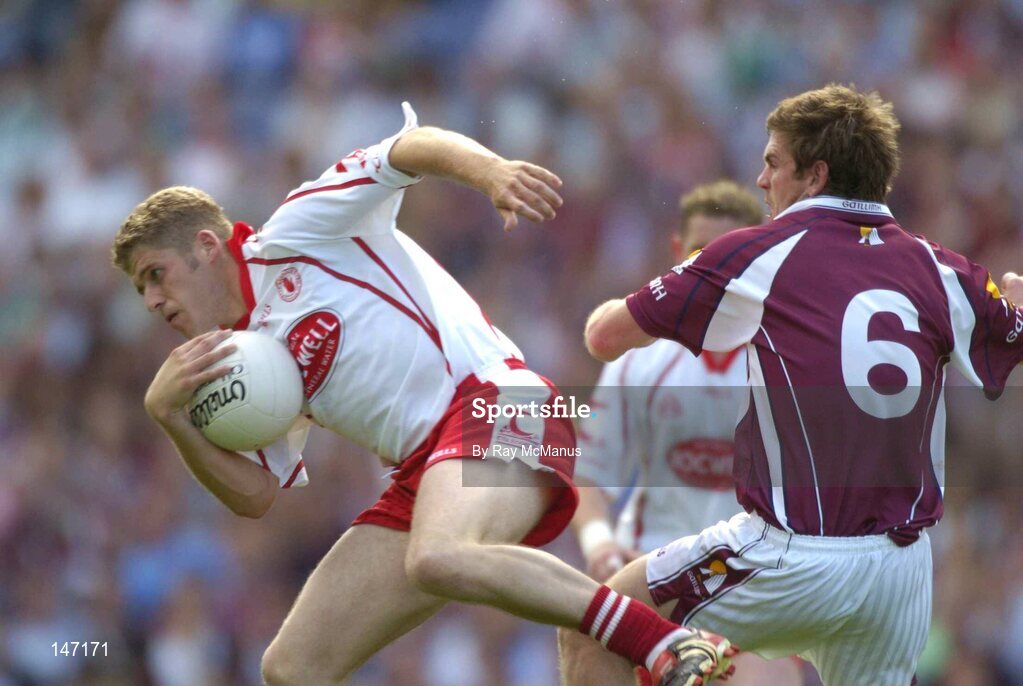 17 July 2004; Kevin Hughes, Tyrone, in action against Paul Clancy, Galway. Bank of Ireland Senior Football Championship Qualifier, Round 3, Tyrone v Galway, Croke Park, Dublin. Picture credit; Ray McManus / SPORTSFILE