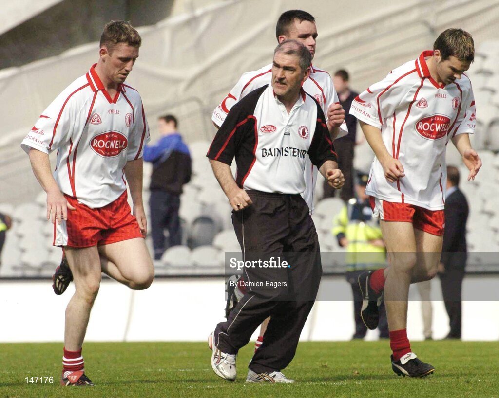 17 July 2004; Tyrone manager Mickey Harte speaks to his players, from left, Michael Coleman, Ryan McMenamin and Shane Sweeney during the warm down. Bank of Ireland Senior Football Championship Qualifier, Round 3, Tyrone v Galway, Croke Park, Dublin. Picture credit; Damien Eagers / SPORTSFILE
